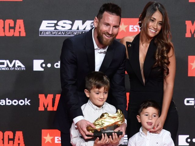 Barcelona's Argentinian forward Lionel Messi (L) poses with his wife Antonella Roccuzzo and his sons Thiago and Mateo after receiving his sixth Golden Shoe award after receiving the 2019 European Golden Shoe honoring the year's leading goalscorer during a ceremony at the Antigua Fabrica Estrella Damm in Barcelona on October 16, 2019. (Photo by Josep LAGO / AFP) (Photo by JOSEP LAGO/AFP via Getty Images)